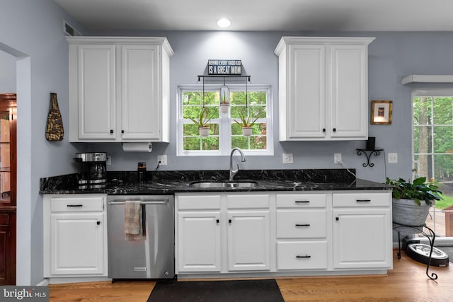 15066 Frederick Rd, Cooksville, MD 21723 - kitchen with dishwasher, a sink, white cabinets, light wood finished floors, and dark stone counters