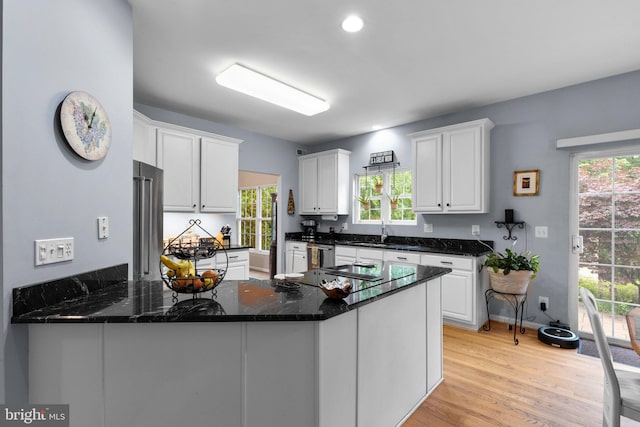 15066 Frederick Rd, Cooksville, MD 21723 - kitchen with white cabinets, a sink, a peninsula, stainless steel appliances, and recessed lighting