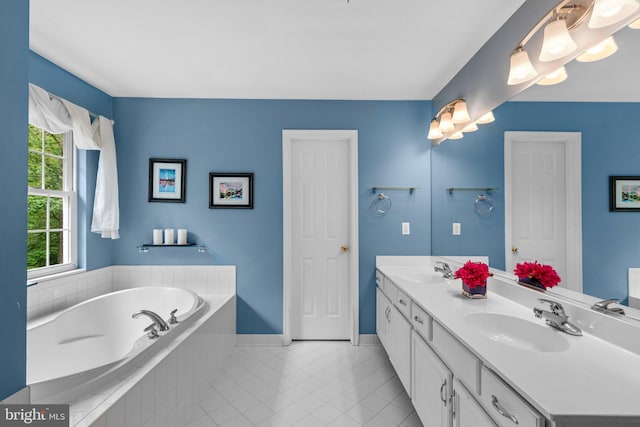 15066 Frederick Rd, Cooksville, MD 21723 - full bathroom featuring a garden tub, baseboards, double vanity, and tile patterned floors