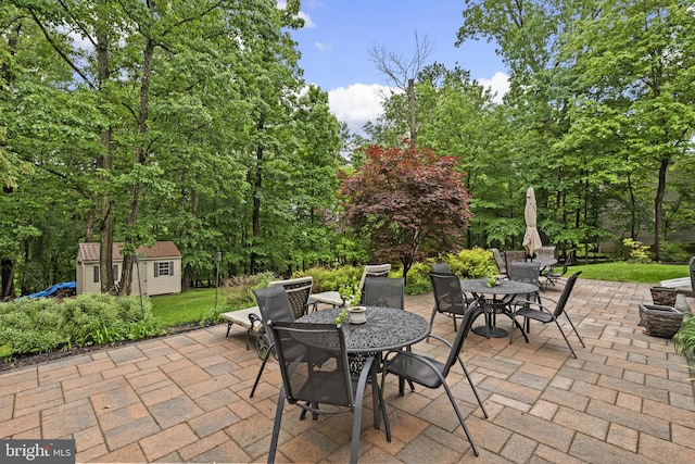 15066 Frederick Rd, Cooksville, MD 21723 - view of patio / terrace featuring outdoor dining area, an outdoor structure, and a storage unit