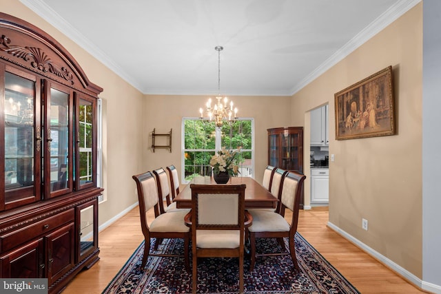 15066 Frederick Rd, Cooksville, MD 21723 - dining space with a chandelier, light wood finished floors, crown molding, and baseboards