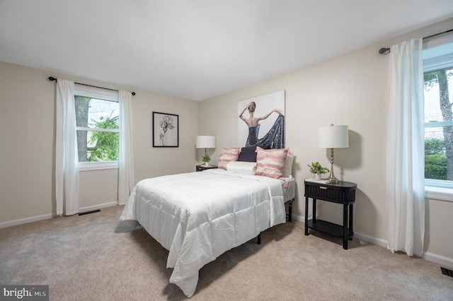 127 Toledo Ln, Willingboro, NJ 08046 - bedroom featuring multiple windows, light colored carpet, and baseboards