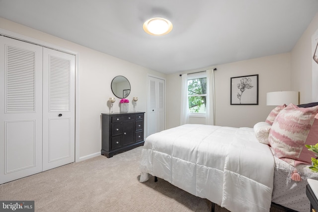 127 Toledo Ln, Willingboro, NJ 08046 - bedroom with two closets, carpet floors, and baseboards