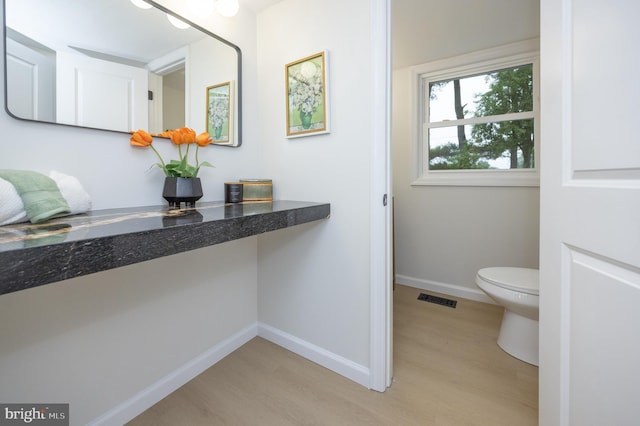 127 Toledo Ln, Willingboro, NJ 08046 - bathroom featuring wood finished floors, baseboards, and toilet