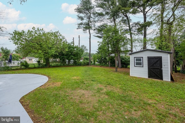 127 Toledo Ln, Willingboro, NJ 08046 - view of green lawn with a storage shed and an outdoor structure