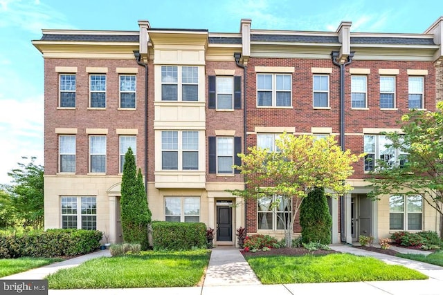 multi unit property featuring brick siding