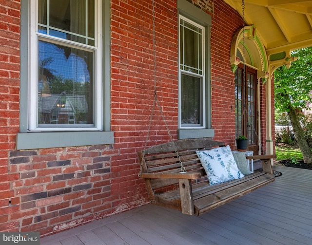 wooden terrace with a porch