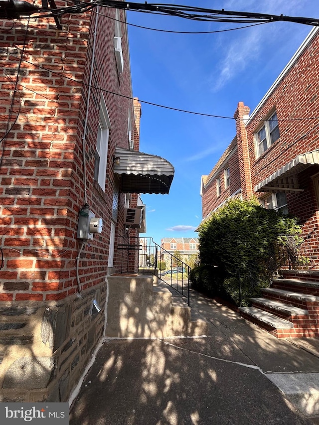 view of side of property with brick siding
