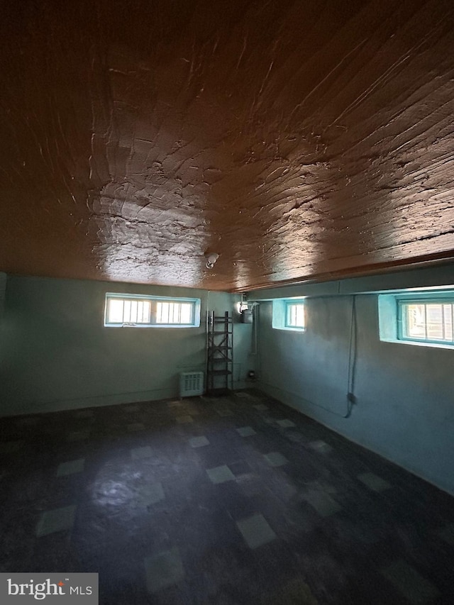 additional living space featuring wood ceiling and plenty of natural light