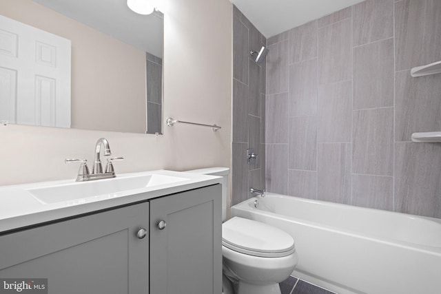 bathroom with toilet, vanity, and bathtub / shower combination