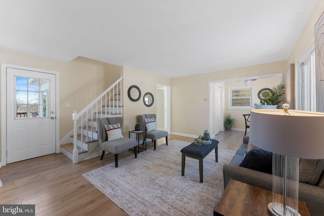5721 Euclid St, Landover, MD 20785 - living area featuring light wood-style flooring, stairs, and baseboards
