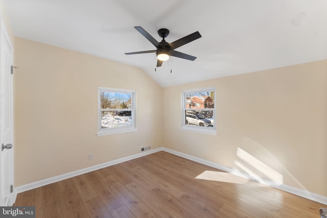 5721 Euclid St, Landover, MD 20785 - spare room featuring healthy amount of natural light, wood finished floors, lofted ceiling, and baseboards