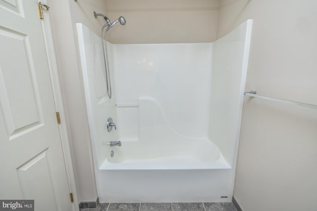 bathroom with washtub / shower combination