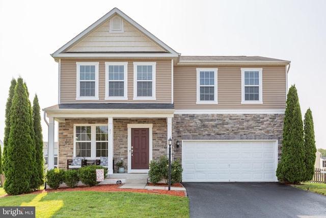 27 Hopkins Branch Way, Fredericksburg, VA 22406 - craftsman inspired home with asphalt driveway, stone siding, a garage, and a front lawn