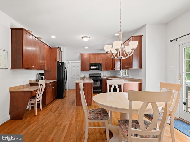 1711 Butternut Cir, West Chester, PA 19382 - kitchen with black appliances, a chandelier, light countertops, light wood-style flooring, and recessed lighting