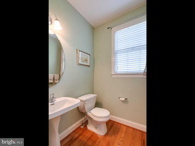 1711 Butternut Cir, West Chester, PA 19382 - bathroom featuring wood finished floors, baseboards, and toilet