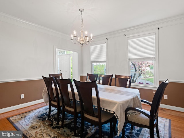 1711 Butternut Cir, West Chester, PA 19382 - dining room with a chandelier, light wood finished floors, baseboards, and crown molding