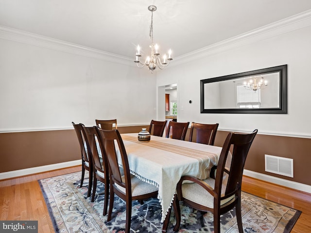1711 Butternut Cir, West Chester, PA 19382 - dining space with a chandelier, crown molding, wood finished floors, and baseboards
