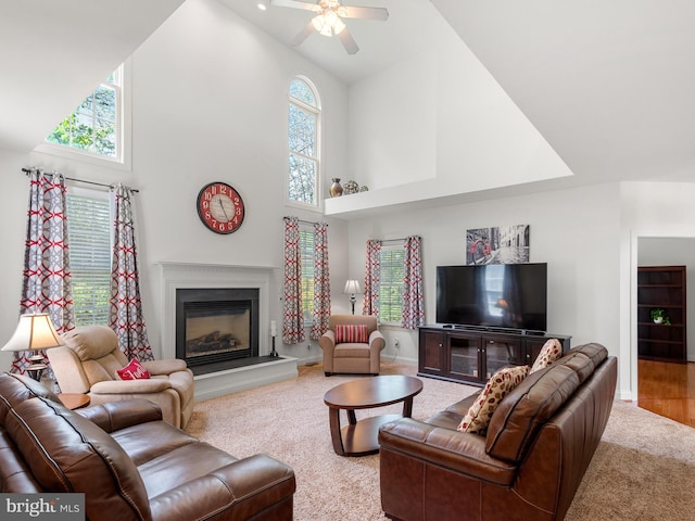 1711 Butternut Cir, West Chester, PA 19382 - living area with a high ceiling, carpet, a glass covered fireplace, ceiling fan, and baseboards