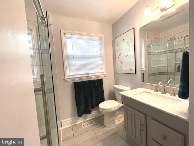 8408 Alvin Rd, Pasadena, MD 21122 - full bathroom featuring a stall shower, vanity, toilet, and baseboards