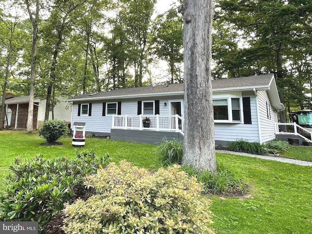 8408 Alvin Rd, Pasadena, MD 21122 - single story home featuring a front lawn and a deck