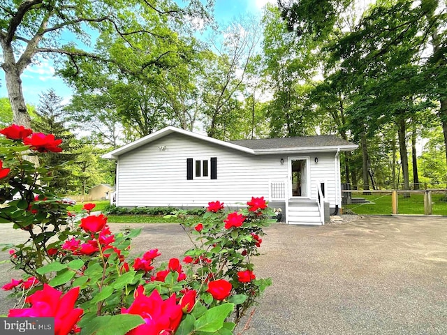 8408 Alvin Rd, Pasadena, MD 21122 - back of house with fence and roof with shingles