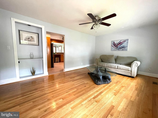 8408 Alvin Rd, Pasadena, MD 21122 - living area featuring wood finished floors, ceiling fan, and baseboards