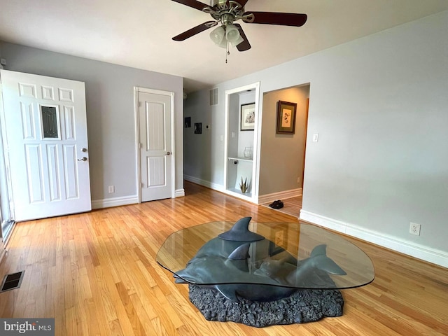 8408 Alvin Rd, Pasadena, MD 21122 - workout area featuring baseboards, a ceiling fan, and wood finished floors