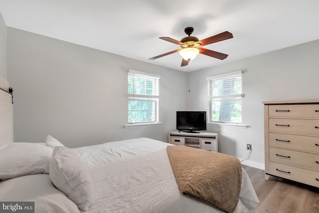 320 Bala Ter W, West Chester, PA 19380 - bedroom with multiple windows, wood finished floors, baseboards, and ceiling fan