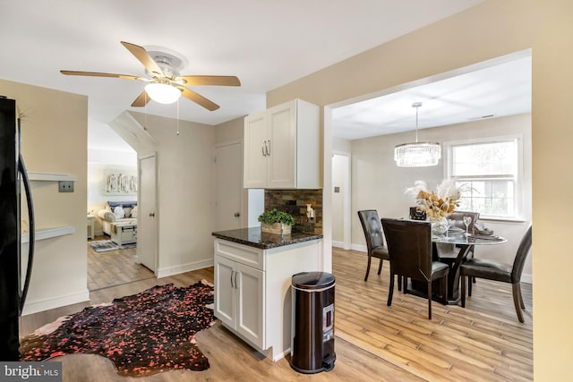320 Bala Ter W, West Chester, PA 19380 - kitchen with white cabinetry, light wood-type flooring, ceiling fan, and a chandelier