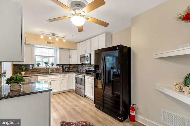 320 Bala Ter W, West Chester, PA 19380 - kitchen with stainless steel appliances, a sink, tasteful backsplash, and dark stone countertops