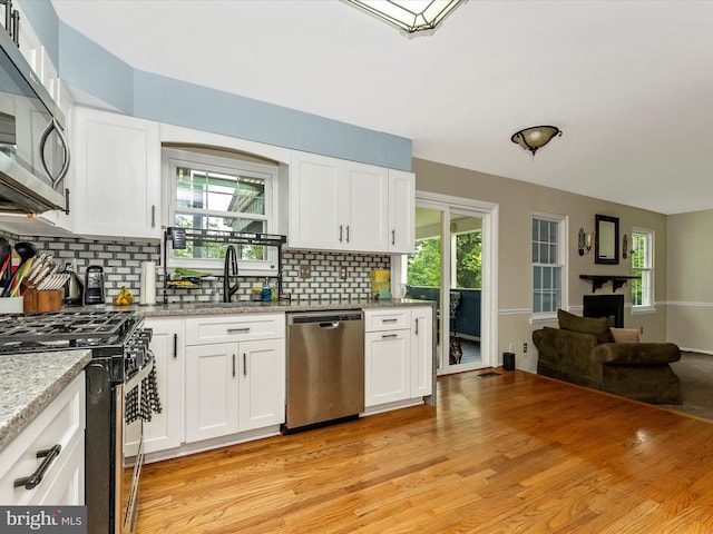 24129 Pecan Grove Ln, Gaithersburg, MD 20882 - kitchen featuring appliances with stainless steel finishes and white cabinets