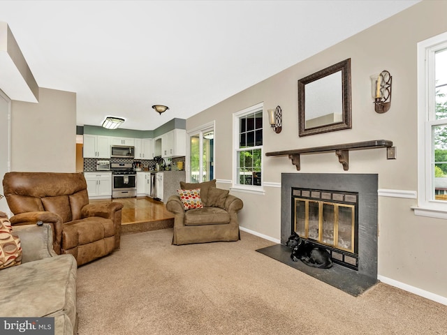 24129 Pecan Grove Ln, Gaithersburg, MD 20882 - living room with carpet flooring, baseboards, a fireplace with flush hearth, and plenty of natural light