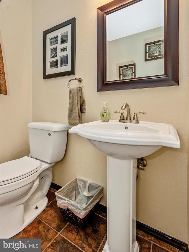 24129 Pecan Grove Ln, Gaithersburg, MD 20882 - bathroom with toilet, a sink, baseboards, and tile patterned flooring