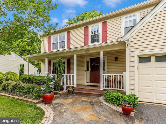 24129 Pecan Grove Ln, Gaithersburg, MD 20882 - view of front of home with a garage and covered porch