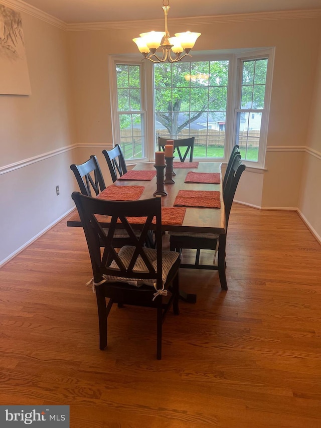 24129 Pecan Grove Ln, Gaithersburg, MD 20882 - dining space with a chandelier, ornamental molding, wood finished floors, and baseboards