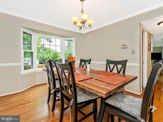 24129 Pecan Grove Ln, Gaithersburg, MD 20882 - dining area featuring a chandelier, light wood-style floors, baseboards, and crown molding