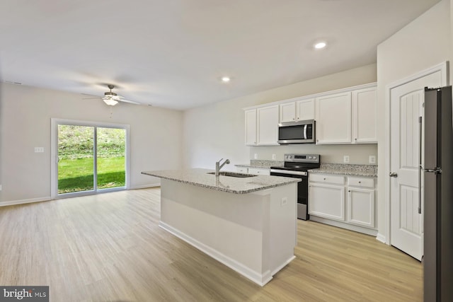 24 Cramsford St, Falling Waters, WV 25419 - kitchen with stainless steel appliances, a sink, ceiling fan, white cabinetry, and recessed lighting