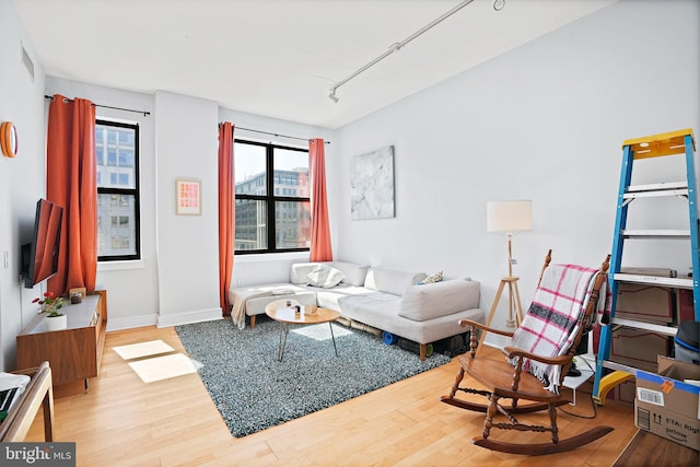 809 6th St NW Unit 63, Washington, DC 20001 - living room with wood finished floors and rail lighting