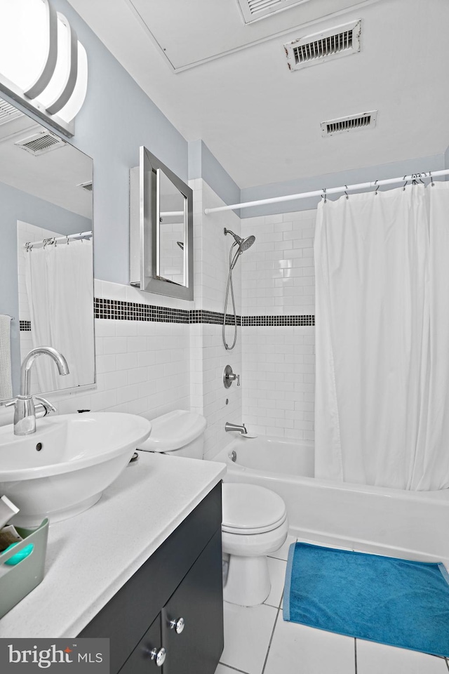 809 6th St NW Unit 63, Washington, DC 20001 - bathroom with vanity, tile walls, shower / bath combo, and tile patterned flooring