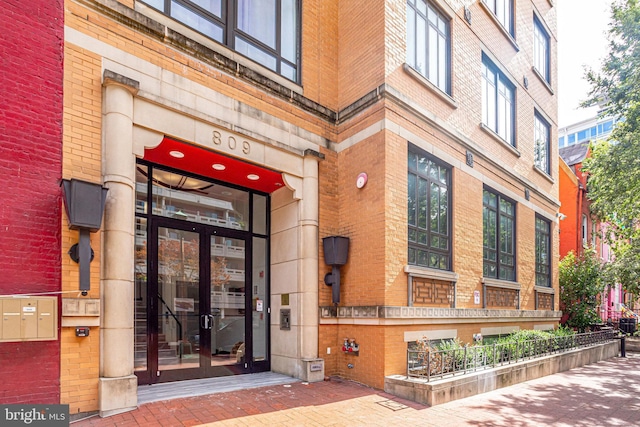 809 6th St NW Unit 63, Washington, DC 20001 - view of exterior entry featuring brick siding and french doors
