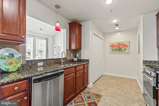 400 Cameron Station Blvd Unit 417, Alexandria, VA 22304 - kitchen featuring appliances with stainless steel finishes, a sink, backsplash, dark stone counters, and baseboards