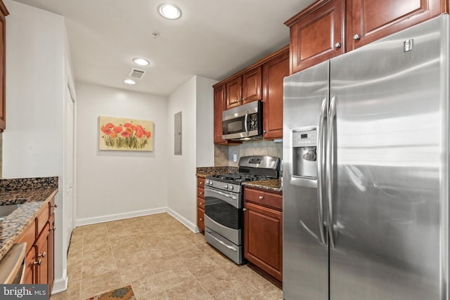 400 Cameron Station Blvd Unit 417, Alexandria, VA 22304 - kitchen featuring stainless steel appliances, dark stone countertops, recessed lighting, baseboards, and tasteful backsplash