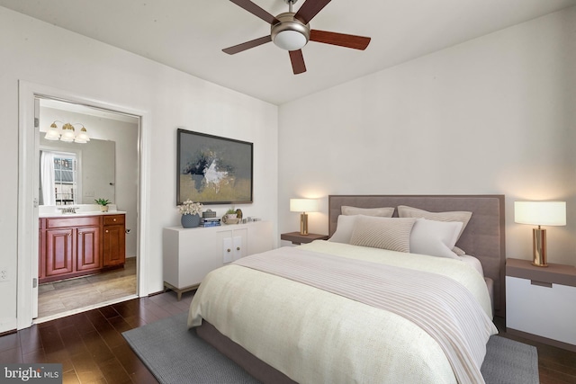 400 Cameron Station Blvd Unit 417, Alexandria, VA 22304 - bedroom with dark wood-style floors, a chandelier, ensuite bath, a sink, and a ceiling fan