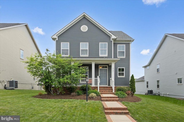 2121 River Heritage Blvd, Dumfries, VA 22026 - view of front of home featuring a porch, central AC unit, and a front yard