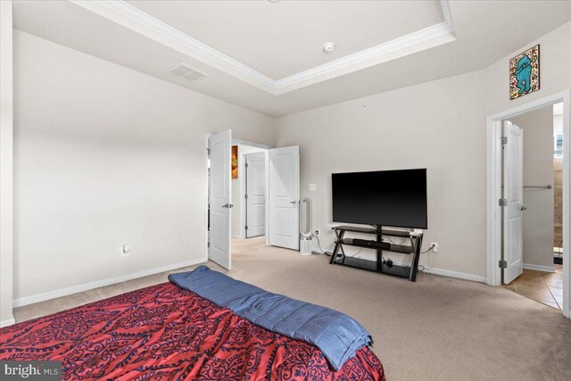 2121 River Heritage Blvd, Dumfries, VA 22026 - carpeted bedroom with ornamental molding, baseboards, and a raised ceiling