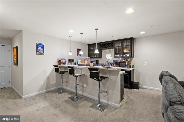 2121 River Heritage Blvd, Dumfries, VA 22026 - indoor wet bar with light carpet, baseboards, hanging light fixtures, and recessed lighting