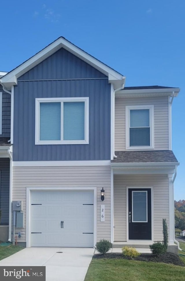 view of front of house featuring an attached garage and driveway