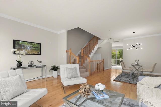 1252 Harbor Island Walk, Baltimore, MD 21230 - living area featuring a chandelier, ornamental molding, stairs, light wood finished floors, and baseboards