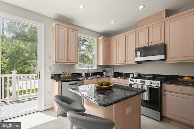 1252 Harbor Island Walk, Baltimore, MD 21230 - kitchen with stainless steel appliances, light brown cabinetry, a sink, light tile patterned flooring, and recessed lighting
